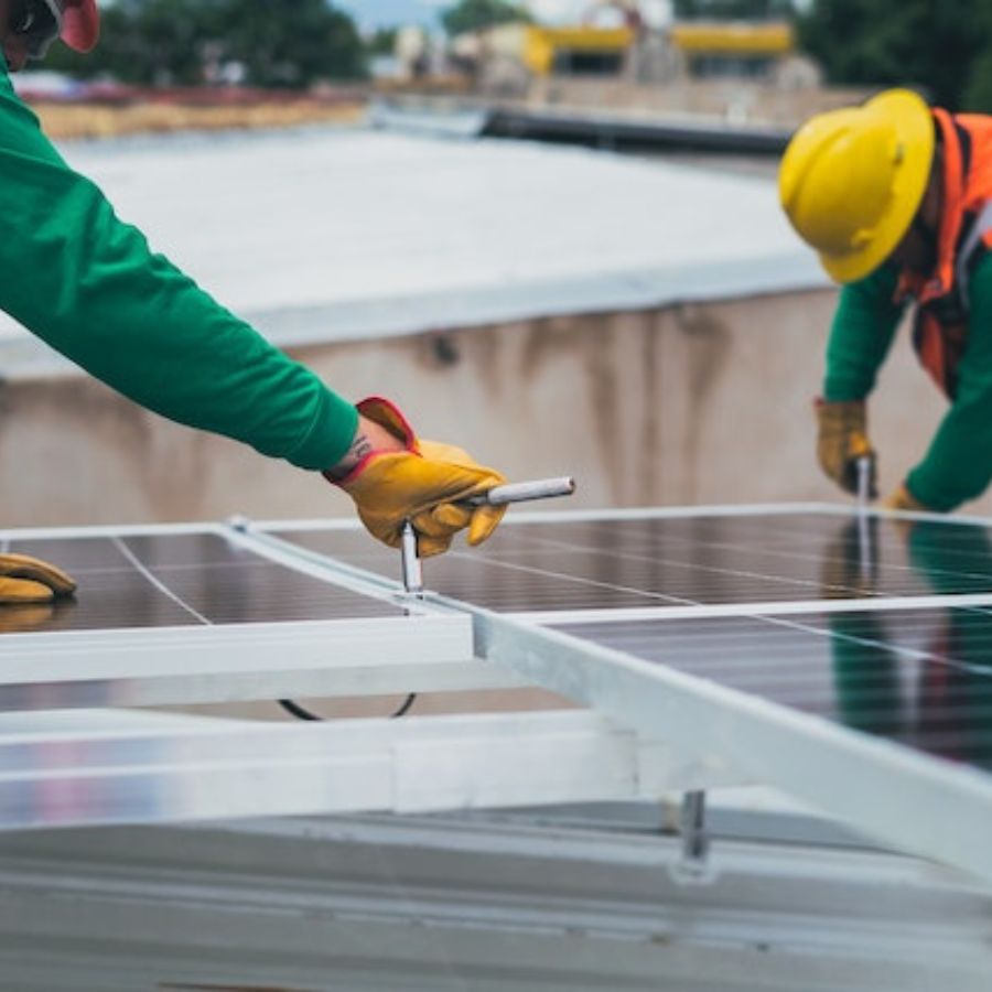 workers installing solar panels