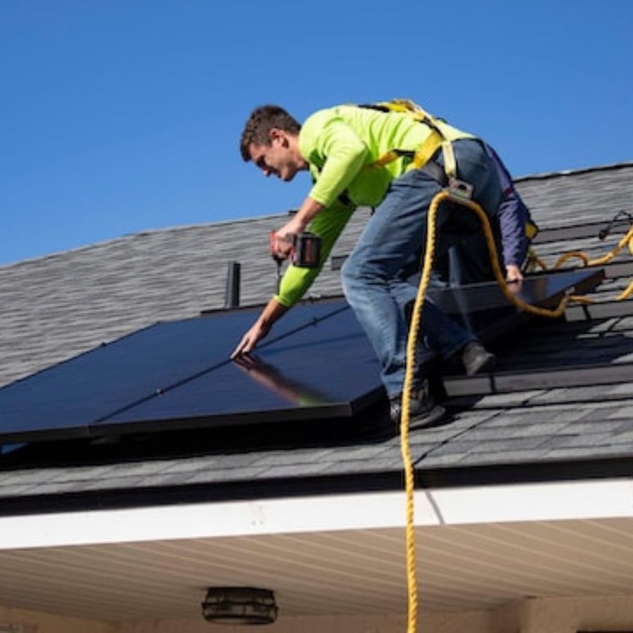 man installing medium size solar panels